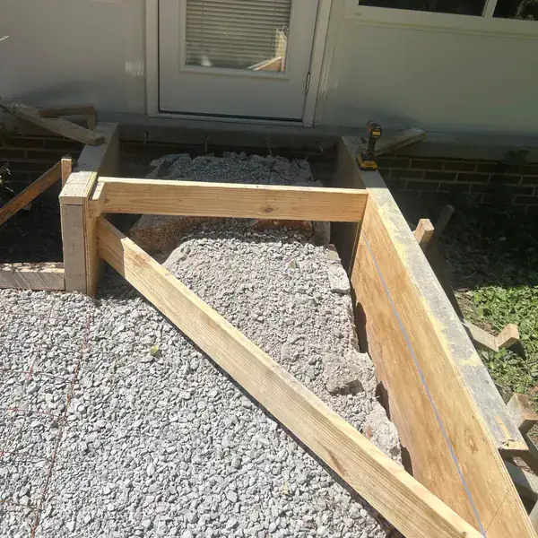 Formwork built around a bay window for a concrete apron