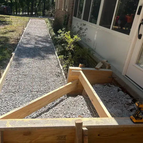 Timber forms and stone base set for a side-yard walkway