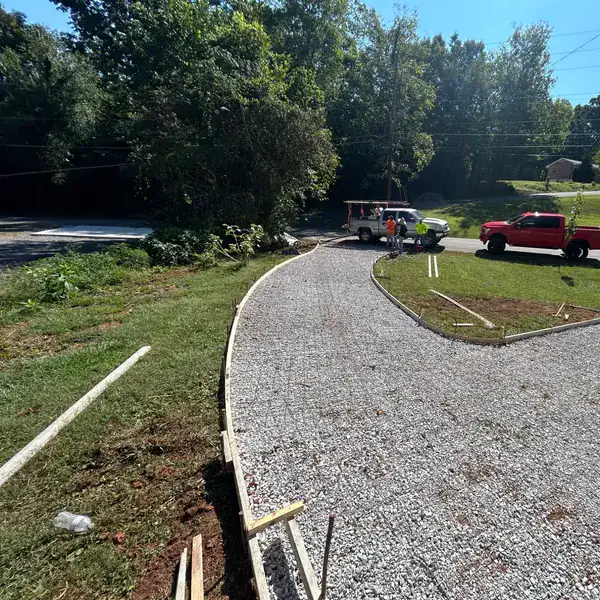 Crushed stone base graded and formed for a curved driveway